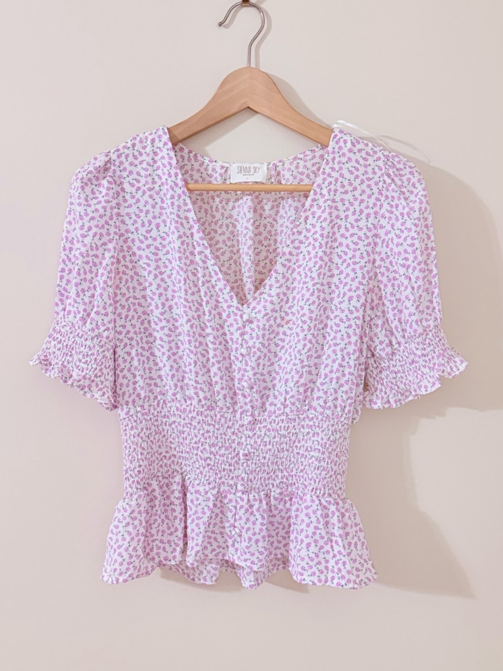 SIENNA SKY • White with Light Pink Floral V-Neck Ruffled Peplum Top